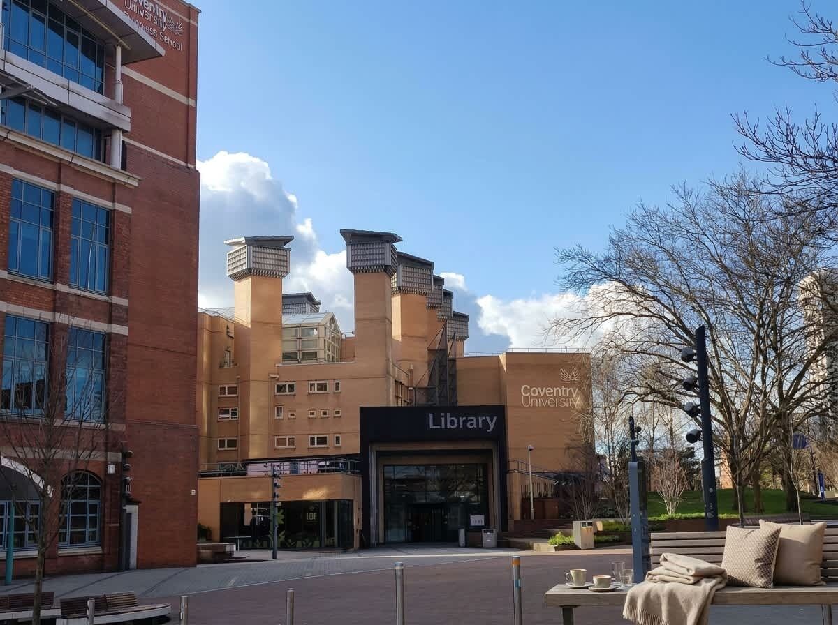 A library building with a prominent entrance and a clear sky above.