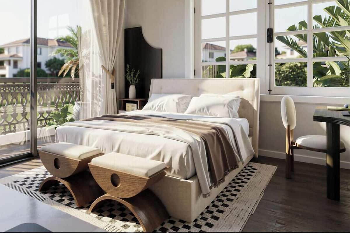 Un dormitorio con una cama grande, un escritorio y una silla.