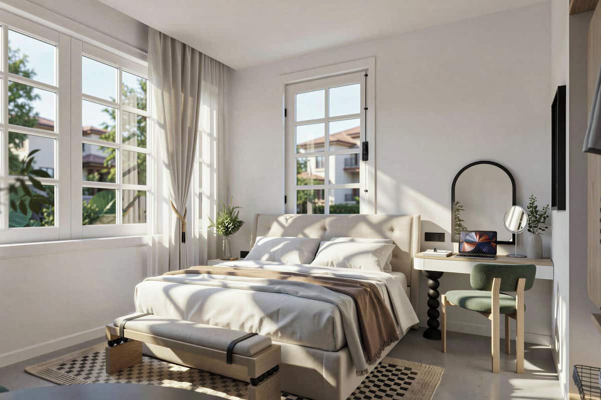 Un dormitorio con cama, escritorio, silla y ventana con cortinas.
