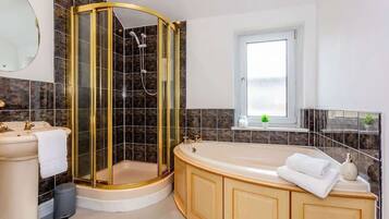 Shower, hair dryer, towels, shampoo