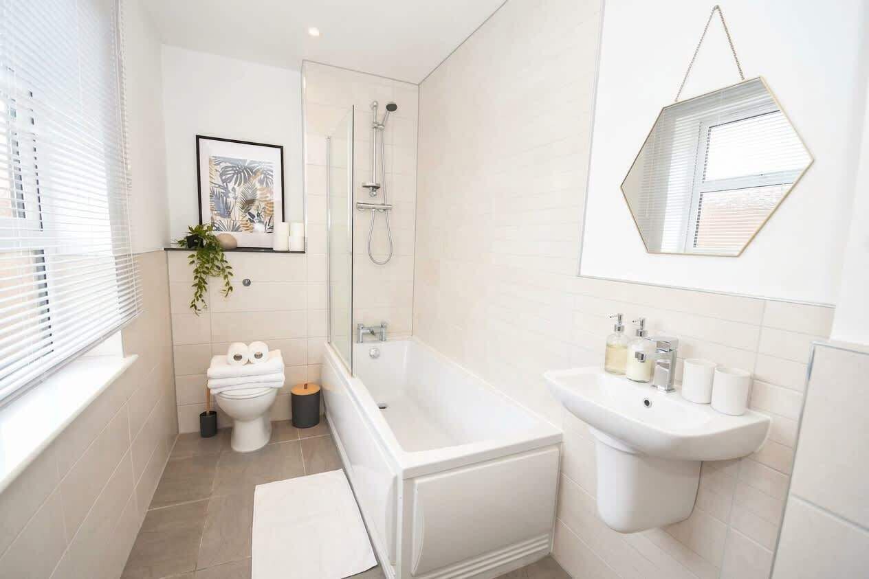 Shower, hair dryer, towels, shampoo