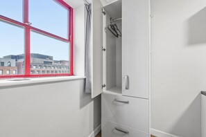 A room with a window, white wardrobe, and a view of buildings. - Bright Budget Double Studio – Heart of Nottingham (Nottingham)