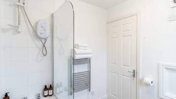 Shower, hair dryer, towels, shampoo