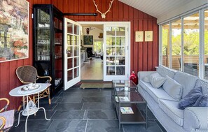 A cozy interior with a sofa, a table, and a chair. - Stunning home in Vig with WiFi (Vig)