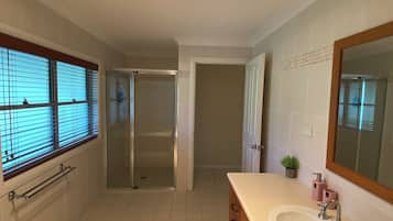 Shower, hair dryer, towels, toilet paper