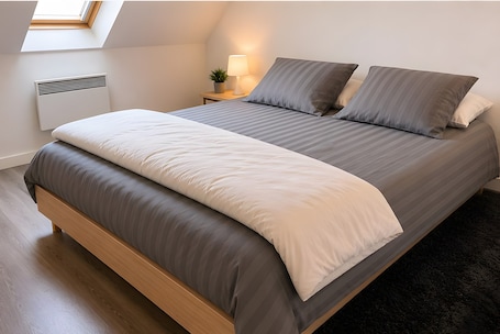 Bed sheets. Le Balcon des Alizées – Beach & Marina Apartment with Balcony