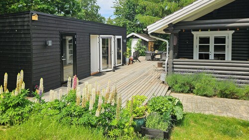 Timber house with view of Hjelm on Helgenæs