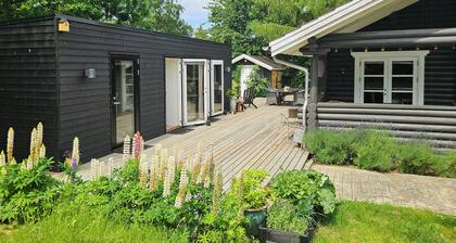 Timber house with view of Hjelm on Helgenæs