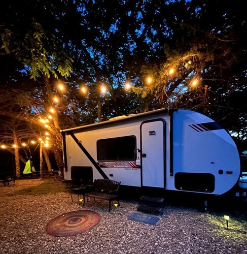 Unique Jungle-Style Glamping RV with 8-Foot Suspended Tree Tent near Creek Trails in Forestburg, Texas