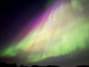 A night sky with the aurora borealis.