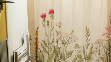 A shower curtain with a floral pattern.
