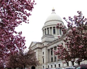 A large building with a prominent dome and classical architecture.