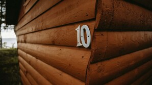A wooden cabin with a number '10' on its side.