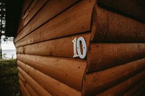 A wooden cabin with a number '10' on its side.