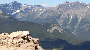 A mountainous landscape with rocky terrain and a valley.
