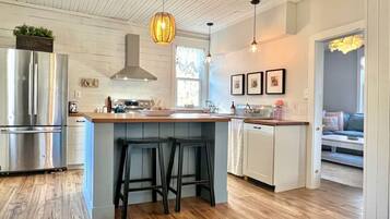 Fridge, microwave, stovetop, dining table