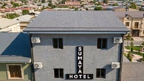 A hotel named 'SUMAYA HOTEL' with a view of a cityscape in the background. - Sumaya Hotel (Tashkent)