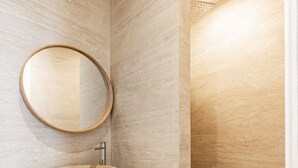 A bathroom with a wooden vanity, a round mirror, and a vessel sink. - 2 People #1 Bedroom #Invalides #Eiffel Tower #Paris 07 (Paris)