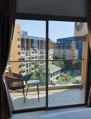 Deluxe Condo, Balcony, Pool View | Balcony view - Lagoona Beach Resort 2 Pattaya (Muang Pattaya)