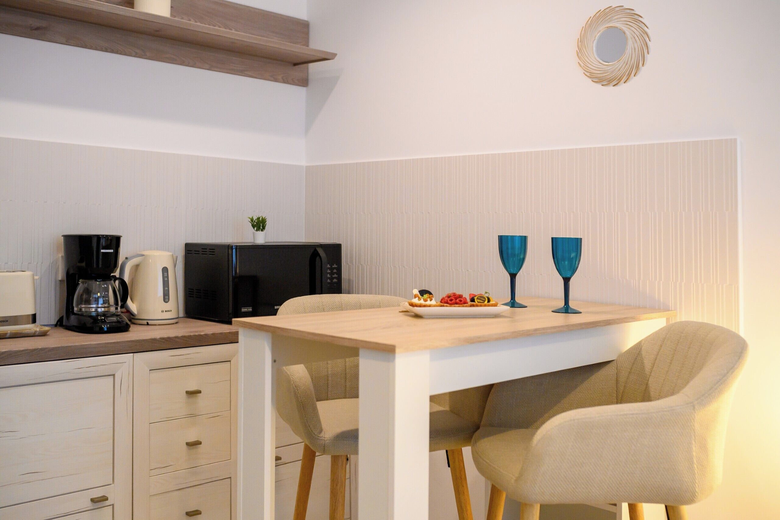 Full-sized fridge, microwave, cookware/dishes/utensils