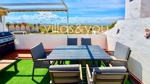An outdoor patio with a table and chairs, a grill, and a view of the landscape. - Torrevista La Mata Penthouse by Villas&You (Torrevieja)