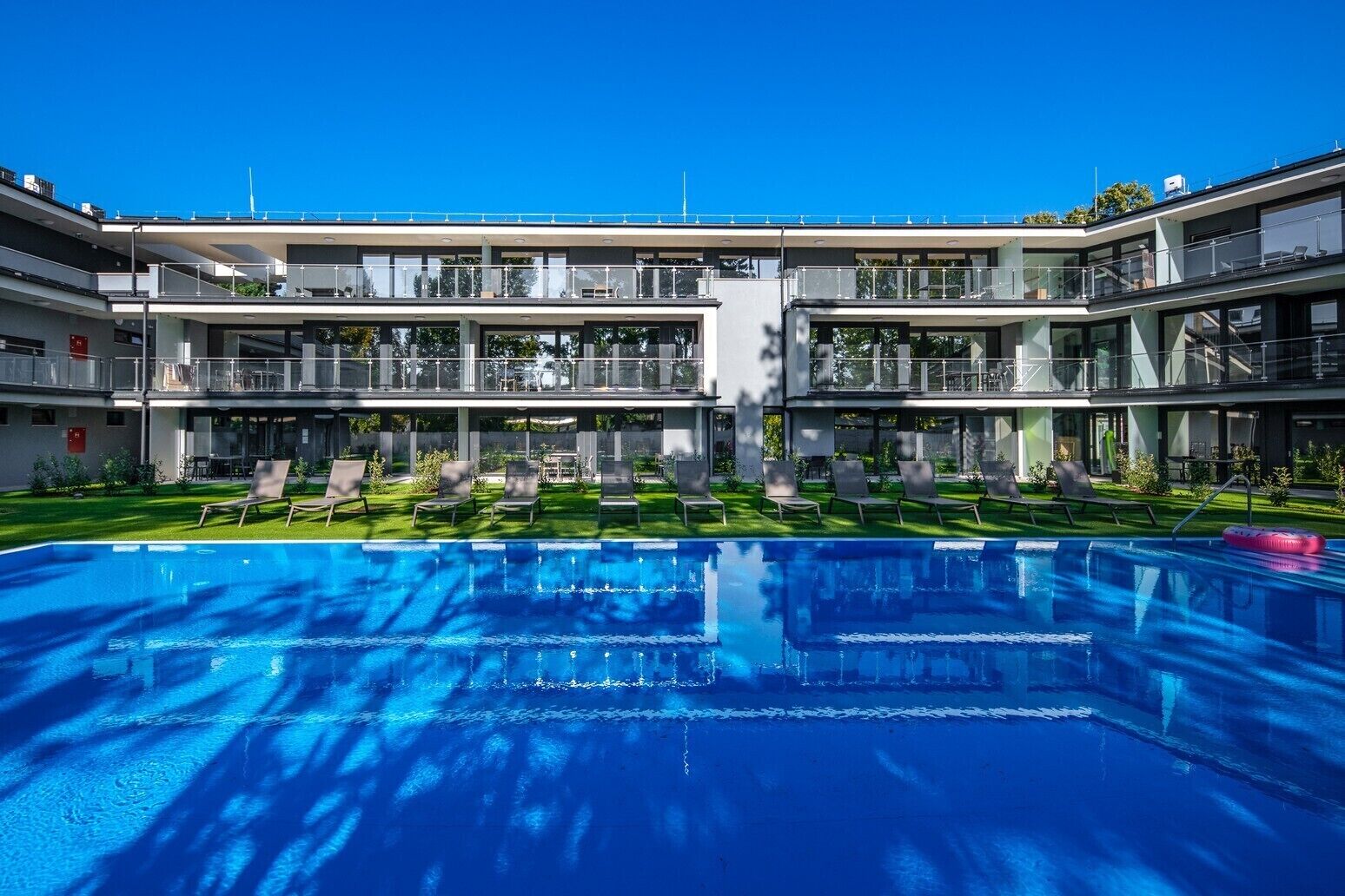 Seasonal outdoor pool, pool loungers
