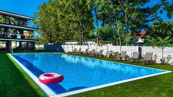 Seasonal outdoor pool, pool loungers