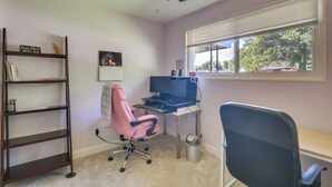 A room with a desk, chair, bookshelf, and a ceiling fan. - Easy Access to Parks, Hospital: St Louis Home (St. Louis)