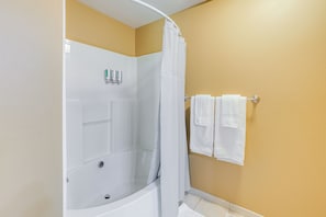 A bathroom with a shower, a bathtub, and a towel rack with towels. - 2 Mi to Dtwn Boise! Condo w/ Pool & Hot Tub Access (Boise)