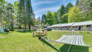 A grassy outdoor area with a hammock, picnic table, and barbecue grill. - Easy Schroon Lake Living! Close to Marina & Town (Schroon Lake)