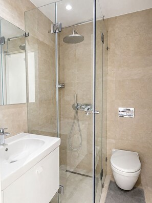 Shower, free toiletries, hair dryer, towels