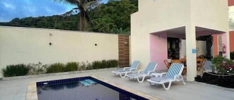 Outdoor pool, open 10:00 AM to 9:00 PM, pool umbrellas, pool loungers
