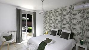 A bedroom with a bed, a chair, a small table, and a window with curtains. - Villa des Amis with jacuzzi and swimming pool near the Alpilles and Luberon mountains (Sorgues)