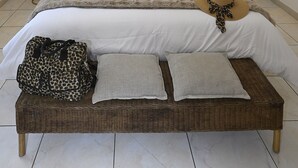 A bedroom with a large bed, two wall-mounted lamps, a woven ceiling light, and two wall art pieces. - Villa des Amis with jacuzzi and swimming pool near the Alpilles and Luberon mountains (Sorgues)