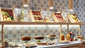 A buffet with various fruits and baked goods. - Angelina Aegina Escape (Aegina)