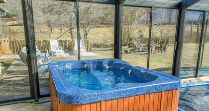Creek-side home with private hot tub, game room, firepit, deck & mountain view