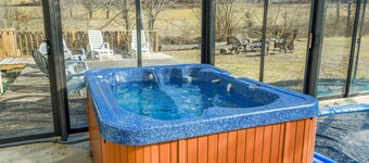 Creek-side home with private hot tub, game room, firepit, deck & mountain view