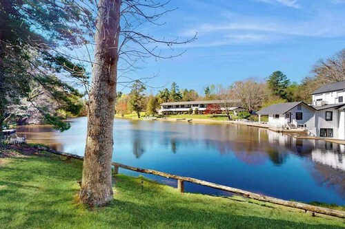 Dog-friendly lakefront condo with pool, canoes, & WiFi - in a perfect location