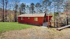 A red cabin with a small porch and a grassy yard. - Once Upon a Cabin, Mountain Views (Murphy)