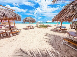 Beach nearby, white sand, beach towels, beach massages
