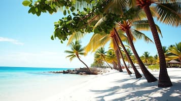 Beach nearby, white sand, beach towels, beach massages