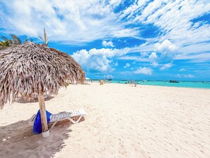Beach nearby, white sand, beach towels, beach massages
