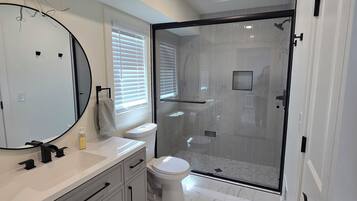 Shower, hair dryer, towels, soap