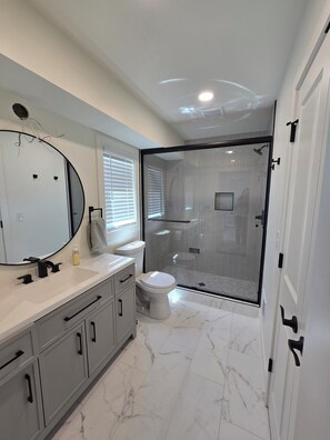Shower, hair dryer, towels, soap