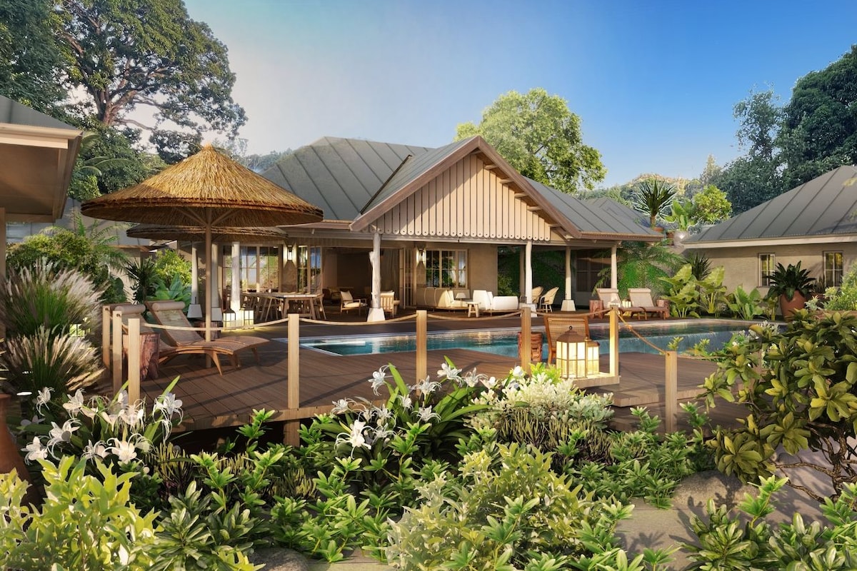A resort with a pool area, lounge chairs, and a covered seating area.