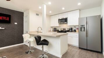Coffee/tea maker, fridge, microwave, oven