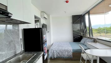 Classic Studio, 1 Large Twin Bed, Kitchen, Mountain View | Desk, blackout drapes, iron/ironing board, free WiFi