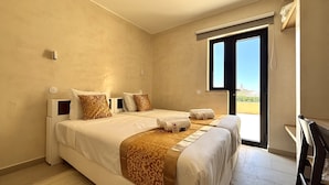 A hotel room with two beds, a large window, and a view of the outside. - Vilamoura Golf Villa 4 by Homing (Loulé)