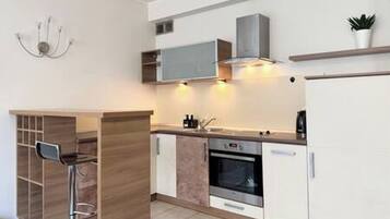 Apartemen | Dapur pribadi | Lemari es, oven, kompor, dan mesin pencuci piring