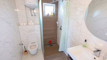 Shower, hair dryer, towels, soap